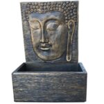 Fonte Cara de Buda em cimento para exterior, ideal para jardins e espaços zen. Disponível em vários acabamentos. Motor vendido em separado.