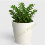 Floreira redonda branca moderna com planta verde natural, ideal para decoração de interiores e exteriores.